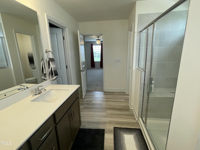 30 Junius Birch Trl, Franklinton, NC 27525 - full bathroom with vanity, a stall shower, toilet, and wood finished floors