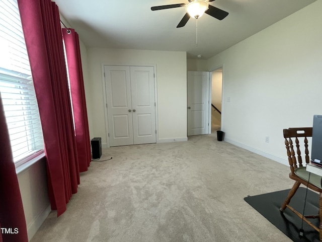 30 Junius Birch Trl, Franklinton, NC 27525 - unfurnished bedroom featuring light carpet, baseboards, ceiling fan, and a closet