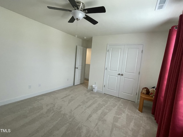 30 Junius Birch Trl, Franklinton, NC 27525 - unfurnished bedroom with light carpet, baseboards, a closet, and ceiling fan