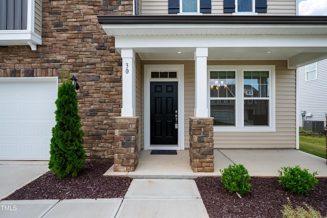 30 Junius Birch Trl, Franklinton, NC 27525 - doorway to property featuring stone siding and covered porch