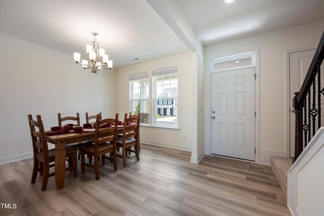 30 Junius Birch Trl, Franklinton, NC 27525 - dining space featuring stairs, a chandelier, and light wood-style floors