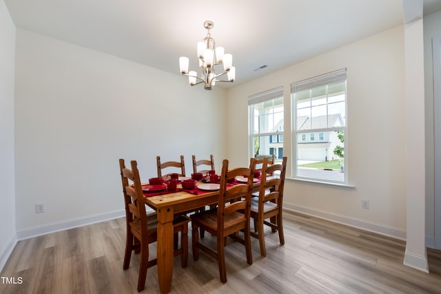 30 Junius Birch Trl, Franklinton, NC 27525 - dining area with a chandelier and light wood-style flooring