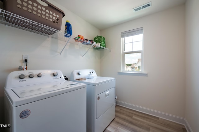 30 Junius Birch Trl, Franklinton, NC 27525 - washroom with light wood-style flooring and washer and clothes dryer