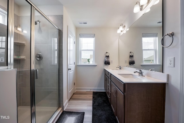 30 Junius Birch Trl, Franklinton, NC 27525 - bathroom with double vanity, plenty of natural light, and a tile shower