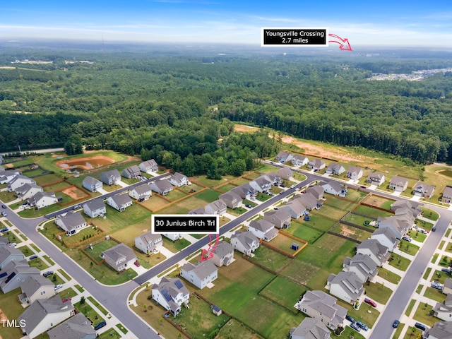 30 Junius Birch Trl, Franklinton, NC 27525 - aerial view of property and surrounding area featuring a forest and nearby suburban area