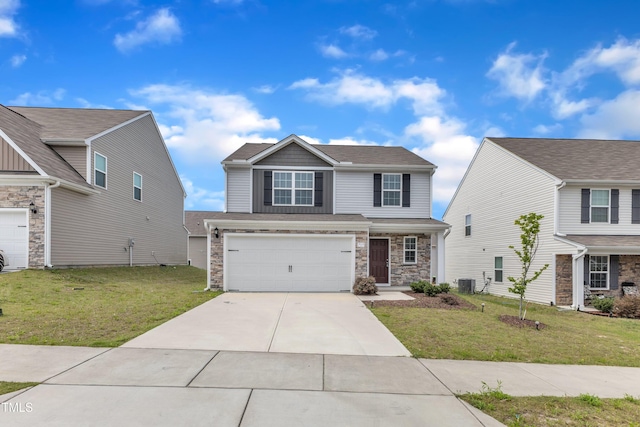 717 Little Patch St, Zebulon, NC 27597 - view of front of home with cooling unit, a front yard, an attached garage, and driveway