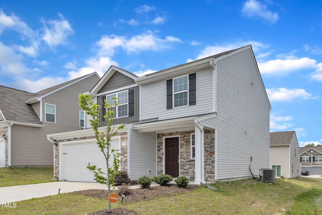 717 Little Patch St, Zebulon, NC 27597 - view of front facade featuring concrete driveway, stone siding, central AC unit, and a front lawn