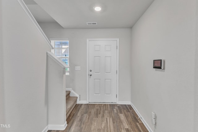 717 Little Patch St, Zebulon, NC 27597 - entryway with stairway, wood finished floors, and baseboards