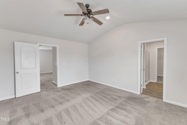 717 Little Patch St, Zebulon, NC 27597 - carpeted empty room featuring ceiling fan, vaulted ceiling, and baseboards