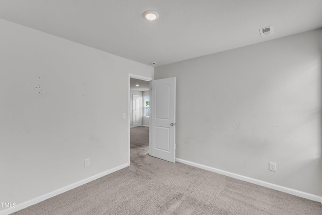 717 Little Patch St, Zebulon, NC 27597 - carpeted empty room with baseboards and recessed lighting