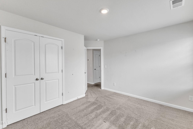 717 Little Patch St, Zebulon, NC 27597 - unfurnished bedroom with carpet, baseboards, and a closet