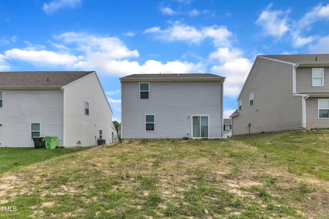 717 Little Patch St, Zebulon, NC 27597 - rear view of house with a lawn and central air condition unit