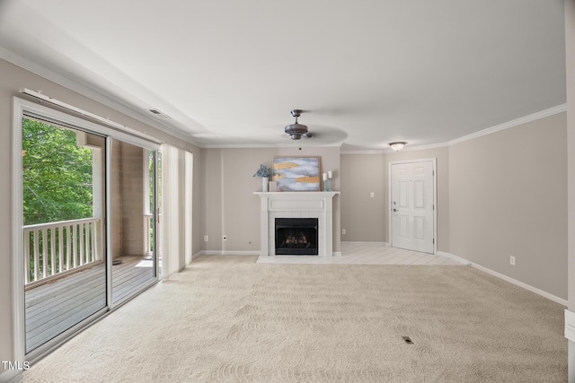 313 Glen Echo Ln Unit J, Cary, NC 27518 - unfurnished living room featuring ceiling fan, crown molding, a tile fireplace, light colored carpet, and baseboards
