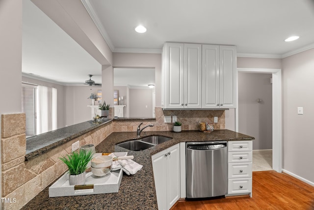 313 Glen Echo Ln Unit J, Cary, NC 27518 - kitchen featuring stainless steel dishwasher, a sink, crown molding, dark stone counters, and white cabinets