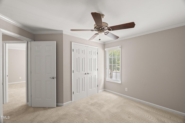 313 Glen Echo Ln Unit J, Cary, NC 27518 - unfurnished bedroom with carpet floors, a closet, crown molding, baseboards, and a ceiling fan
