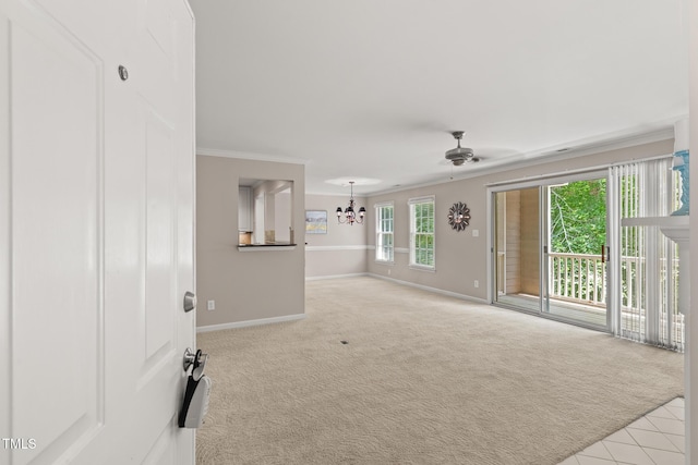 313 Glen Echo Ln Unit J, Cary, NC 27518 - spare room with a chandelier, baseboards, carpet floors, ornamental molding, and a ceiling fan