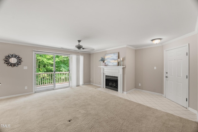 313 Glen Echo Ln Unit J, Cary, NC 27518 - unfurnished living room with crown molding, ceiling fan, a tiled fireplace, baseboards, and light tile patterned floors