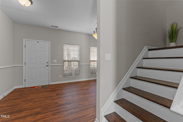 821 Stackhurst Way, Wake Forest, NC 27587 - foyer entrance with wood finished floors, stairway, and baseboards