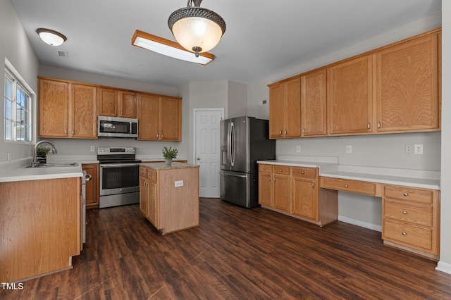 821 Stackhurst Way, Wake Forest, NC 27587 - kitchen with appliances with stainless steel finishes, a sink, dark wood-type flooring, and a center island