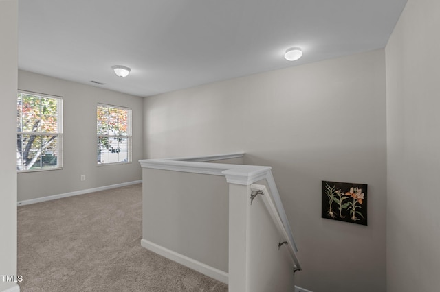 821 Stackhurst Way, Wake Forest, NC 27587 - corridor with an upstairs landing, carpet flooring, and baseboards