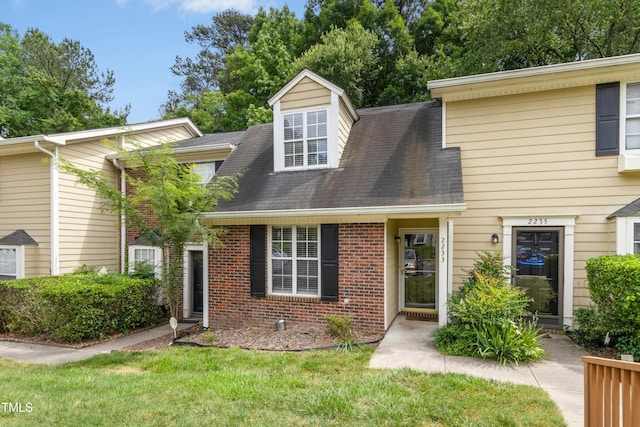 2233 Alpine Rd, Durham, NC 27707 - view of property featuring brick siding and a shingled roof