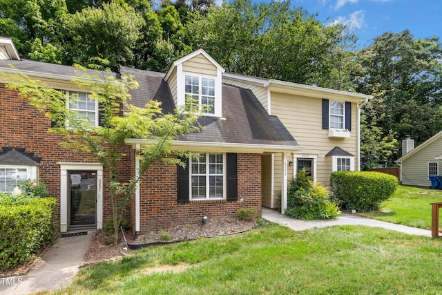 2233 Alpine Rd, Durham, NC 27707 - view of front of home featuring a front yard and brick siding