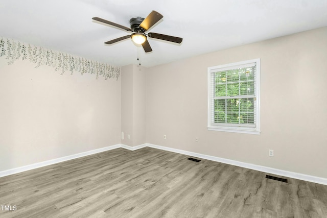 2233 Alpine Rd, Durham, NC 27707 - unfurnished room featuring wood finished floors, baseboards, and ceiling fan