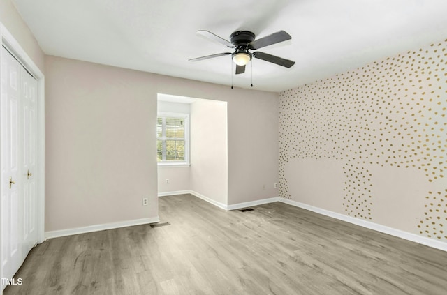 2233 Alpine Rd, Durham, NC 27707 - unfurnished bedroom featuring a closet, wood finished floors, baseboards, and ceiling fan