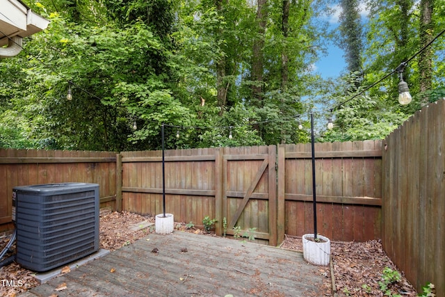 2233 Alpine Rd, Durham, NC 27707 - wooden deck featuring central AC and a fenced backyard