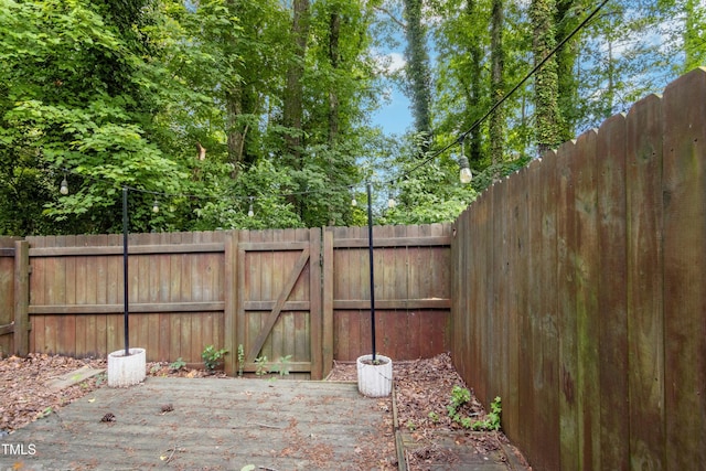 2233 Alpine Rd, Durham, NC 27707 - fenced backyard featuring a gate