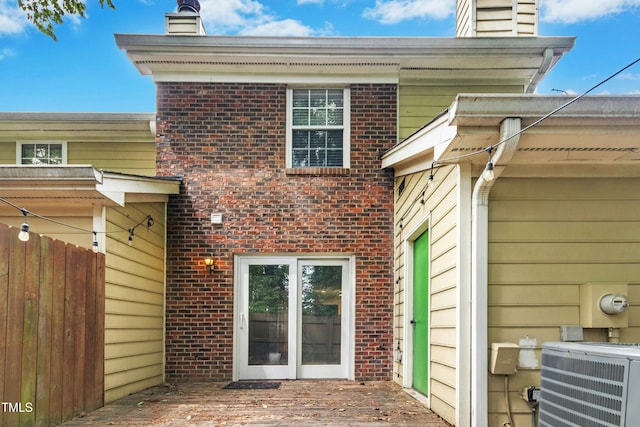 2233 Alpine Rd, Durham, NC 27707 - rear view of property with a chimney, central AC, and brick siding