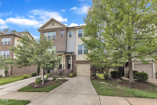 218 Irving Way, Durham, NC 27703 - view of front of home with brick siding, driveway, and an attached garage