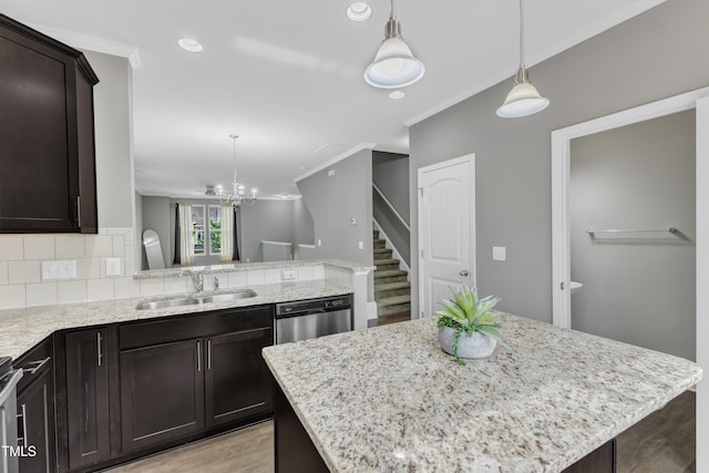 218 Irving Way, Durham, NC 27703 - kitchen with a sink, light wood-style flooring, stainless steel dishwasher, crown molding, and a peninsula
