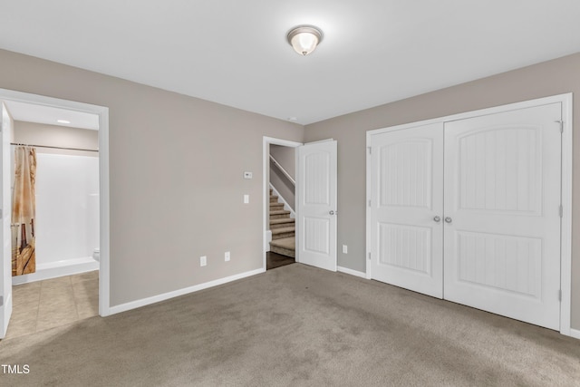 218 Irving Way, Durham, NC 27703 - unfurnished bedroom with carpet flooring, a closet, baseboards, and ensuite bath