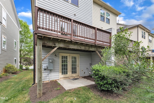 218 Irving Way, Durham, NC 27703 - rear view of house with a deck and a yard