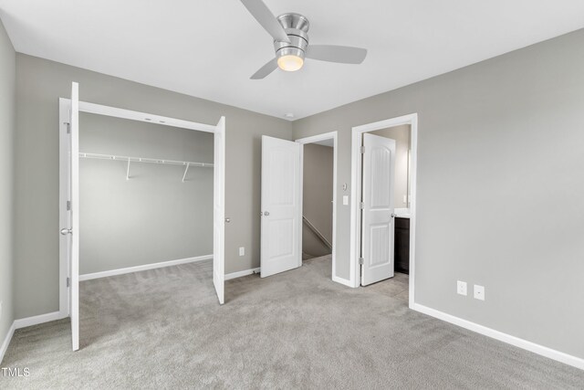 218 Irving Way, Durham, NC 27703 - unfurnished bedroom featuring a closet, baseboards, carpet, and a ceiling fan