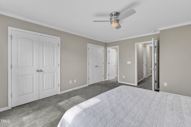 218 Irving Way, Durham, NC 27703 - carpeted bedroom with multiple closets, ornamental molding, baseboards, and ceiling fan