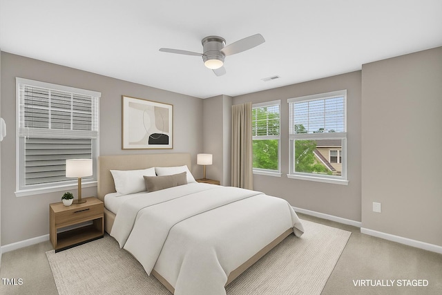 218 Irving Way, Durham, NC 27703 - bedroom featuring baseboards, light colored carpet, and a ceiling fan
