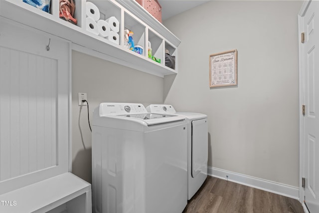784 Cypress Rd, Cameron, NC 28326 - washroom featuring washing machine and clothes dryer, dark wood-style floors, and baseboards