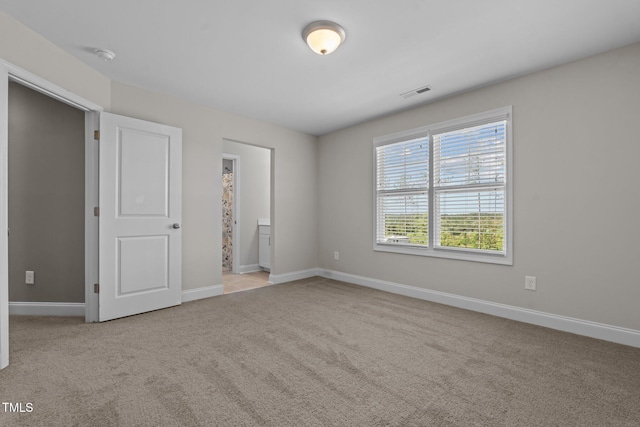 784 Cypress Rd, Cameron, NC 28326 - unfurnished bedroom featuring carpet, baseboards, and ensuite bath