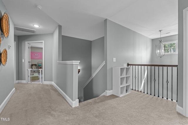 784 Cypress Rd, Cameron, NC 28326 - hall featuring an upstairs landing, carpet flooring, a chandelier, and baseboards