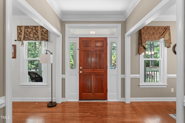 8536 Wolverton Fields Dr, Wake Forest, NC 27587 - entrance foyer featuring wood finished floors, plenty of natural light, baseboards, and crown molding