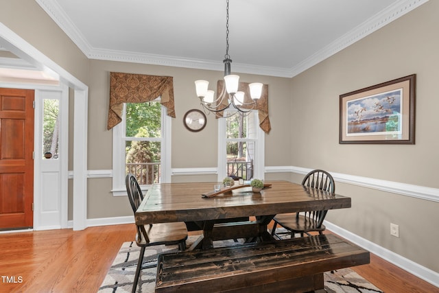 8536 Wolverton Fields Dr, Wake Forest, NC 27587 - dining space featuring a chandelier, light wood finished floors, crown molding, and baseboards