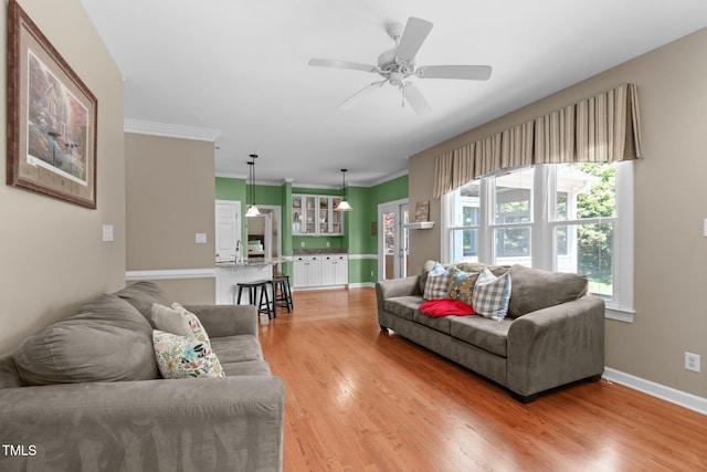 8536 Wolverton Fields Dr, Wake Forest, NC 27587 - living area featuring light wood-style flooring, a ceiling fan, and baseboards
