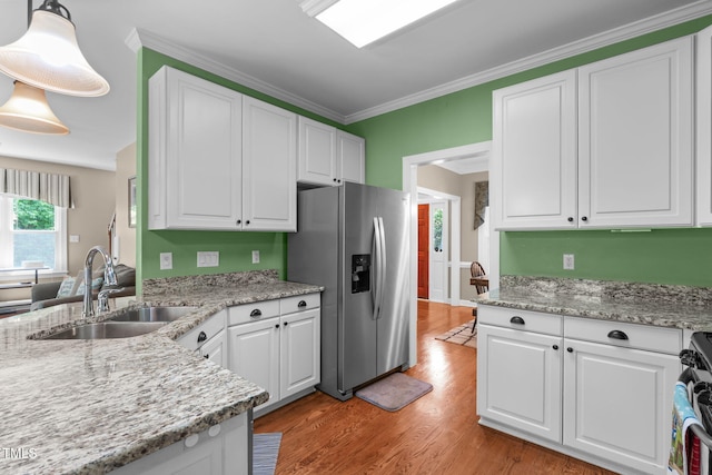 8536 Wolverton Fields Dr, Wake Forest, NC 27587 - kitchen featuring stainless steel refrigerator with ice dispenser, a sink, white cabinetry, light wood-type flooring, and ornamental molding