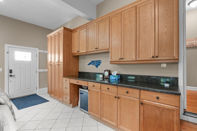 8536 Wolverton Fields Dr, Wake Forest, NC 27587 - kitchen featuring wine cooler, light tile patterned floors, and dark stone countertops