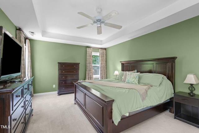 8536 Wolverton Fields Dr, Wake Forest, NC 27587 - bedroom featuring light colored carpet, a tray ceiling, ceiling fan, and baseboards
