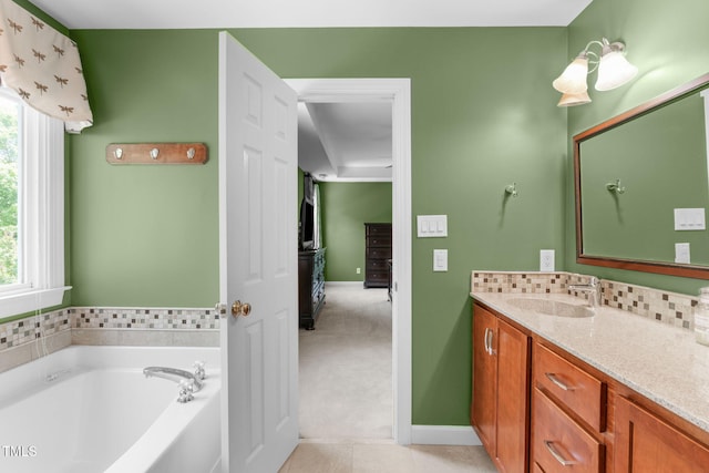 8536 Wolverton Fields Dr, Wake Forest, NC 27587 - bathroom featuring vanity, healthy amount of natural light, a bath, and tile patterned flooring
