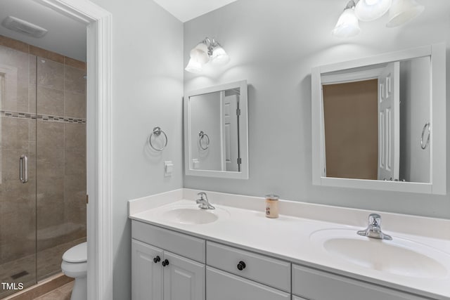 8536 Wolverton Fields Dr, Wake Forest, NC 27587 - full bath featuring double vanity, a shower stall, and toilet