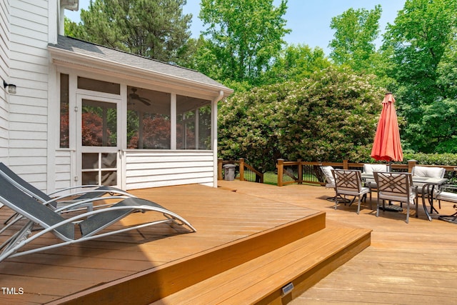 8536 Wolverton Fields Dr, Wake Forest, NC 27587 - wooden terrace with a sunroom, outdoor dining area, and view of wooded area